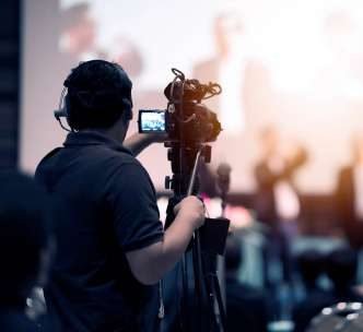 Videographer filming at an event
